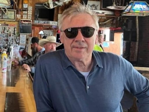 Real Madrid coach Carlo Ancelotti drinks in a saloon in Montana town