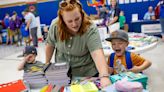 Photo of the day: Offering smiles and school supplies to dependent military children