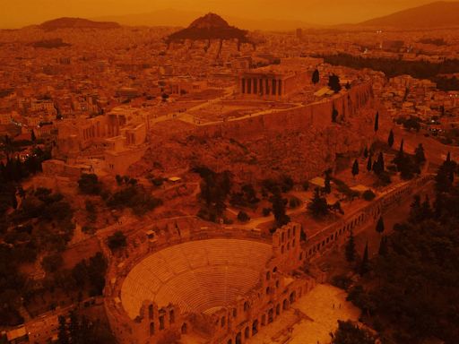 Eerie, orange skies loom over Athens as dust storm engulfs southern Greece