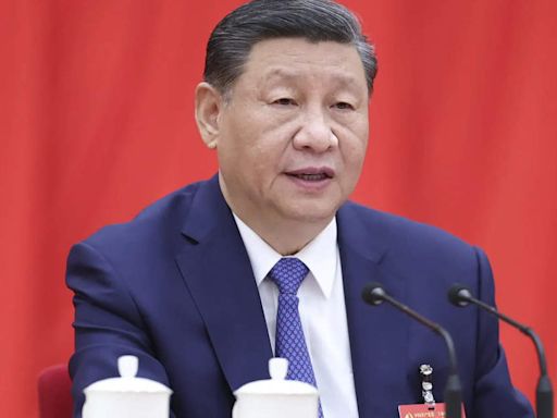 Top Chinese Communist Party body endorses comprehensive reforms to halt economic slowdown; highlights Xi Jinping's "core" leadership