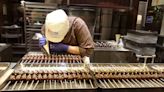 Japan's June factory activity eases as costs rise, PMI shows