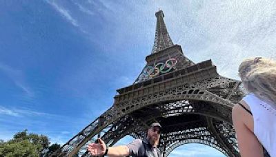 Police arrest a man climbing the Eiffel Tower, prompting an evacuation hours before closing ceremony