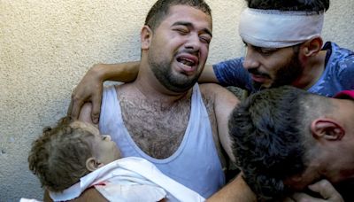 A Gaza father mourns his baby boy, killed in bed by an Israeli airstrike