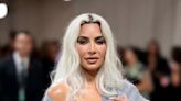 Kim Kardashian shocks with tiny waist in corset at Met Gala while others slam 'grandad cardigan'