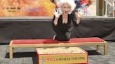 Cyndi Lauper makes her mark outside Hollywood's famed Chinese Theatre