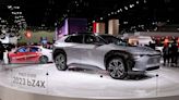 Toyota rolls out first battery electric car in cautious debut as rivals go full-throttle