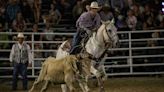 Contestants adjust for wet conditions at the Buffalo Bill Rodeo