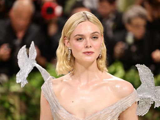 Elle Fanning Puts Icy Spin on Met Gala 2024’s Theme in ‘Crystal’ Balmain Gown With Sculpted Birds Holding Up the Sleeves