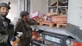 Videos show Israeli soldiers in Gaza burning food, vandalizing a shop and ransacking private homes