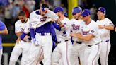 World champion Rangers overcome disputed tip and beat Cubs 4-3 on Heim's 10th-inning single