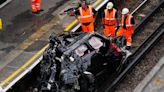 Woman dies in crash that leaves Range Rover on railway track