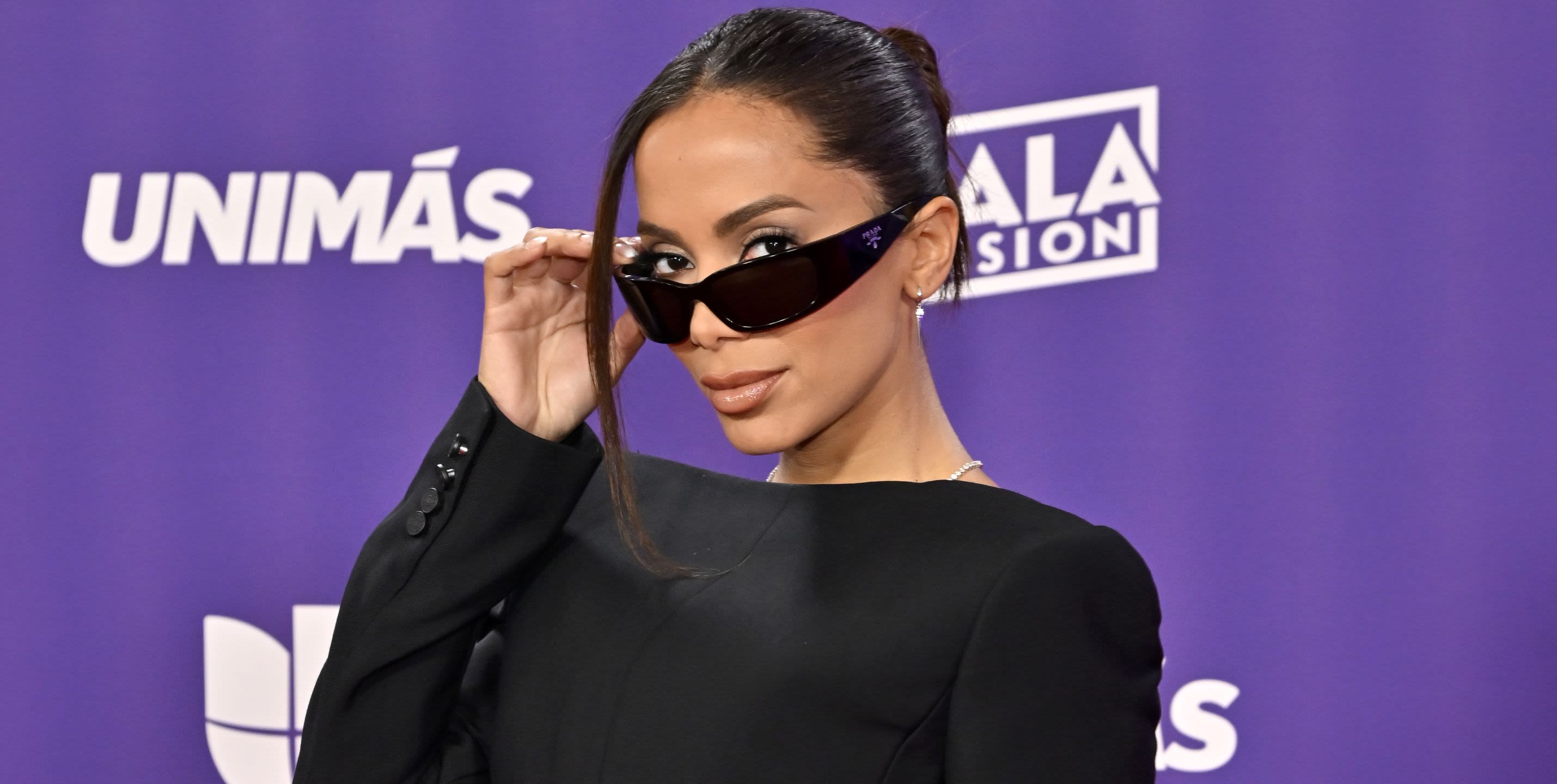 Anitta’s corset mini dress and sunglasses is a high-fashion twist on Men in Black chic