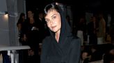 Katie Holmes Sports a Nose Ring and Black Hooded Dress at Tom Ford's New York Fashion Week Show