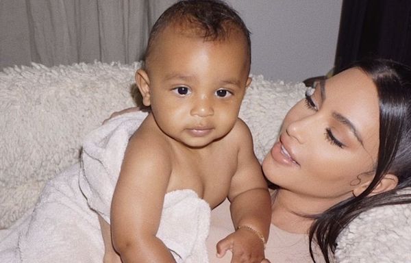 Psalm West, 4, looks grown up as he and mom Kim attend Saint's basketball game