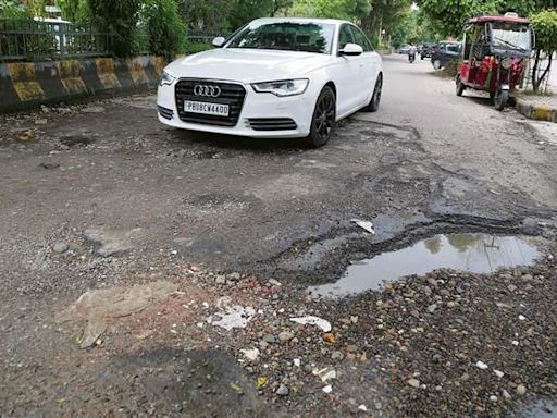 Potholed Cool Road gives commuters a bumpy ride