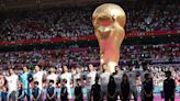 Iranian fans savour victory but wrangle over protests