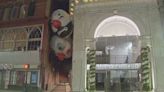 Clownin’ around: Clown heads hanging outside of Suffolk Univ. theater as part of art installation