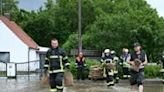 Sandbags were piled on a flooded street in Baar-Ebenhausen, Germany, on Sunday