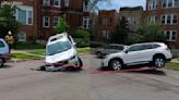 Car crashes into sinkhole in Uptown, photos show