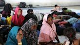 Indonesian Navy drive away boat carrying Rohingya Muslims as students storm shelter