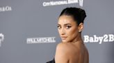 Shay Mitchell just went completely nude, hiding behind a