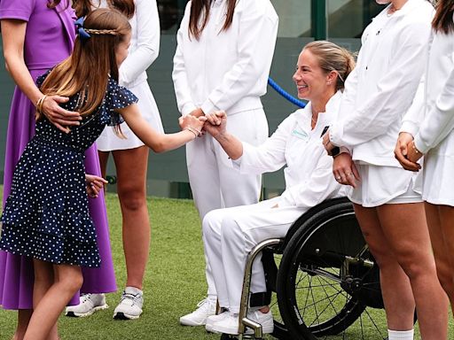 Princess Charlotte makes a Pinky promise with Lucy Shuker at Wimbledon