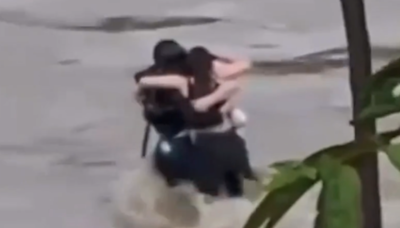 Italy floods: Heartbreaking footage of three friends hugging before being swept away