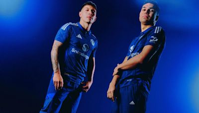 Manchester United unveil 90s-inspired dark blue away kit