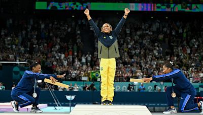 Photos preserve the most iconic moments from the Paris Olympics, including Simone Biles bowing after defeat and Noah Lyles becoming the fastest man in the world