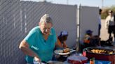 A woman was arrested for feeding homeless people in Arizona. Now she's suing the city.