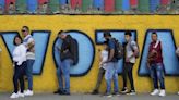 Normally bustling Venezuelan capital is unusually quiet after both sides claim victory in election