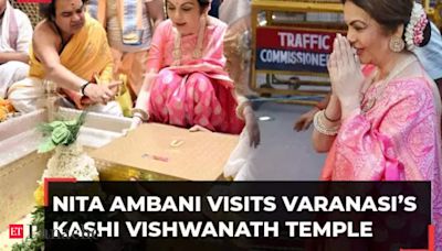 Nita Ambani at Kashi Vishwanath temple, offers son's wedding invitation to Lord Shiva; enjoys food at a local chaat shop