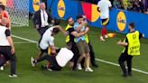 Spain's Alvaro Morata suffers injury scare after security guard slides into him during celebrations