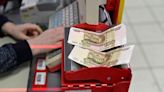 Rouble falls past 61 vs dollar as conversion of depository receipts begins