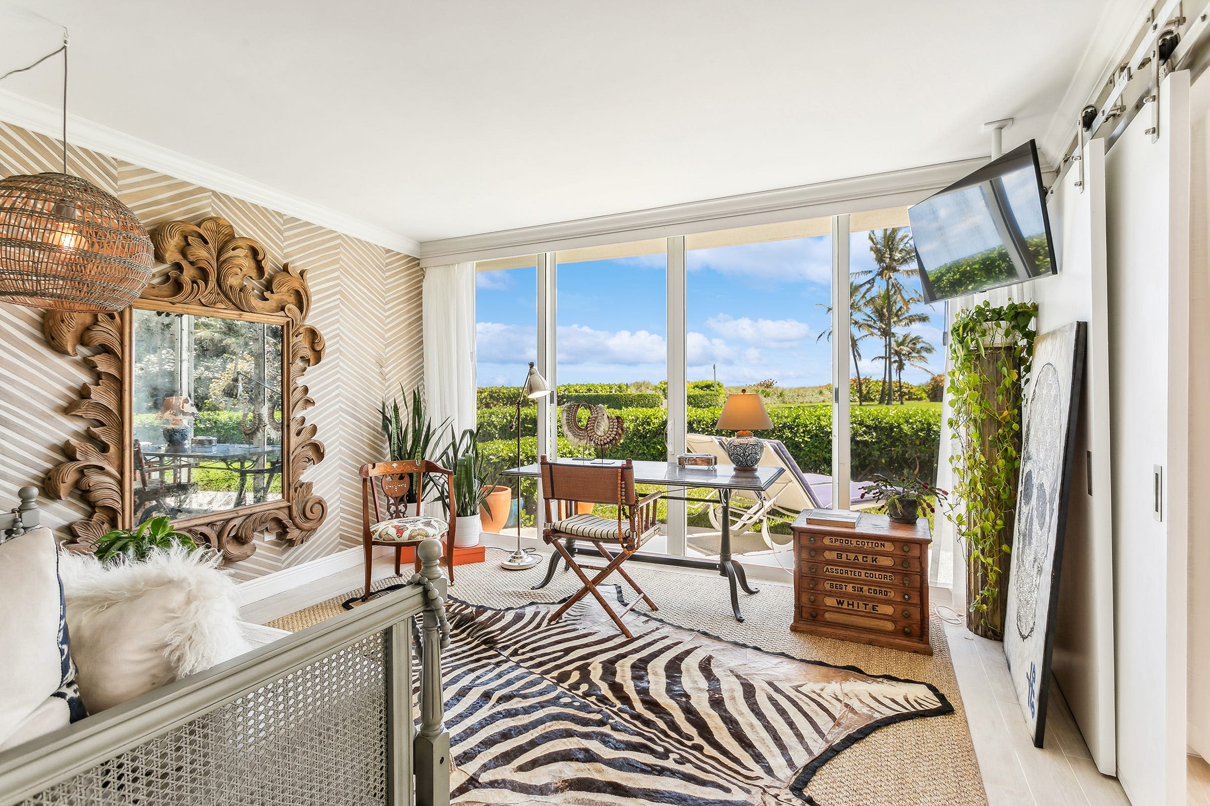 Listed in Palm Beach, a ground-floor co-op on the South End affords indoor-outdoor living