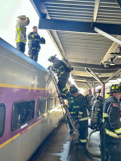 Boston firefighters put out small engine fire on spare commuter rail train at North Station - The Boston Globe