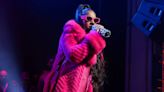 Ashanti Radiates Joy as She Debuts Baby Bump On Stage