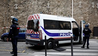 Armed French police arrest man 'threatening to blow himself up' at Iranian consulate in Paris