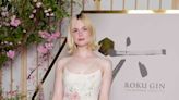 Elle Fanning Pulled a Carrie Bradshaw in This Flirty, Summer-Perfect Dress