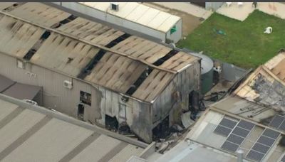 Two men charged with arson after fatal factory fire in Melbourne