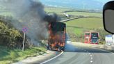 Double decker bus bursts into flames on A30