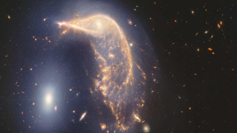 Webb Space Telescope's latest cosmic shot shows pair of intertwined galaxies glowing