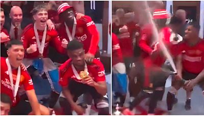 Kobbie Mainoo removed Amad Diallo from United celebrations when the champagne started spraying