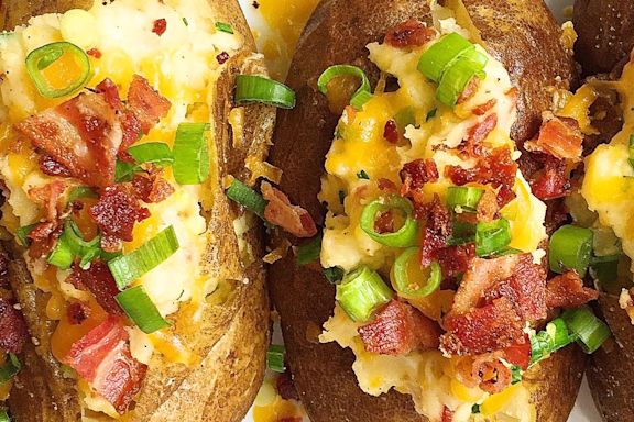 Give The Basic Baked Potato An Upgrade With These Cheesy Loaded Baked Potatoes