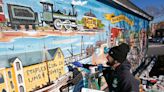 Artist Phill Bourque bringing Weir Village mural back to life