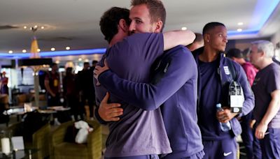 Gareth Southgate and his England players embrace following Euros loss