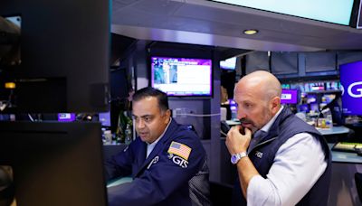FTSE 100 LIVE: European and US stocks mixed as big week for Wall Street begins