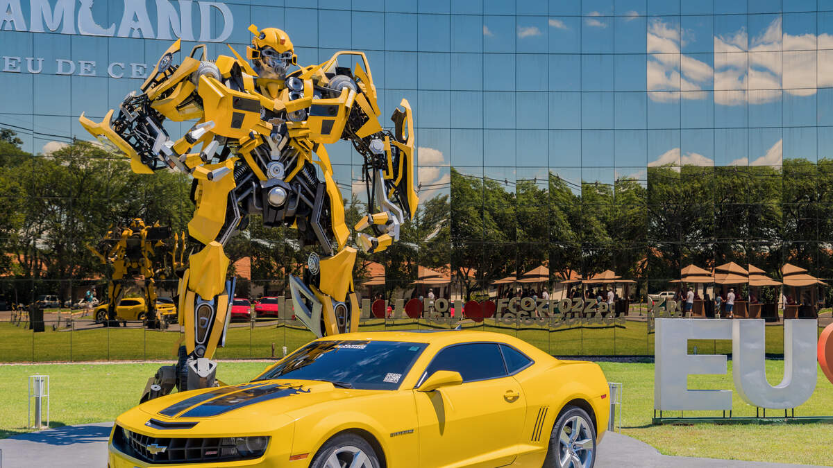 Naked Guy Sits On Top Of Bumblebee Transformer Statue | Real 106.1 | The Insomniac