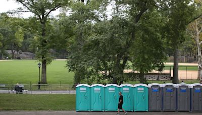 Man charged with overturning port-a-potty, trapping woman and child inside