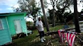 Residents pick through the rubble of lost homes and scattered belongings in Hurricane Idalia's wake